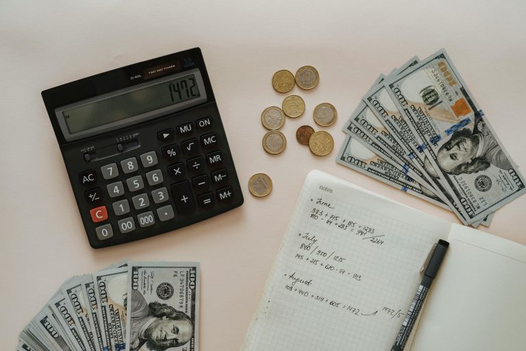 Coins and bill notes on a table.