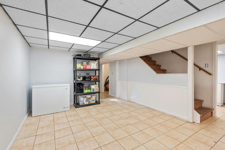 A well lighted and beautiful home basement.